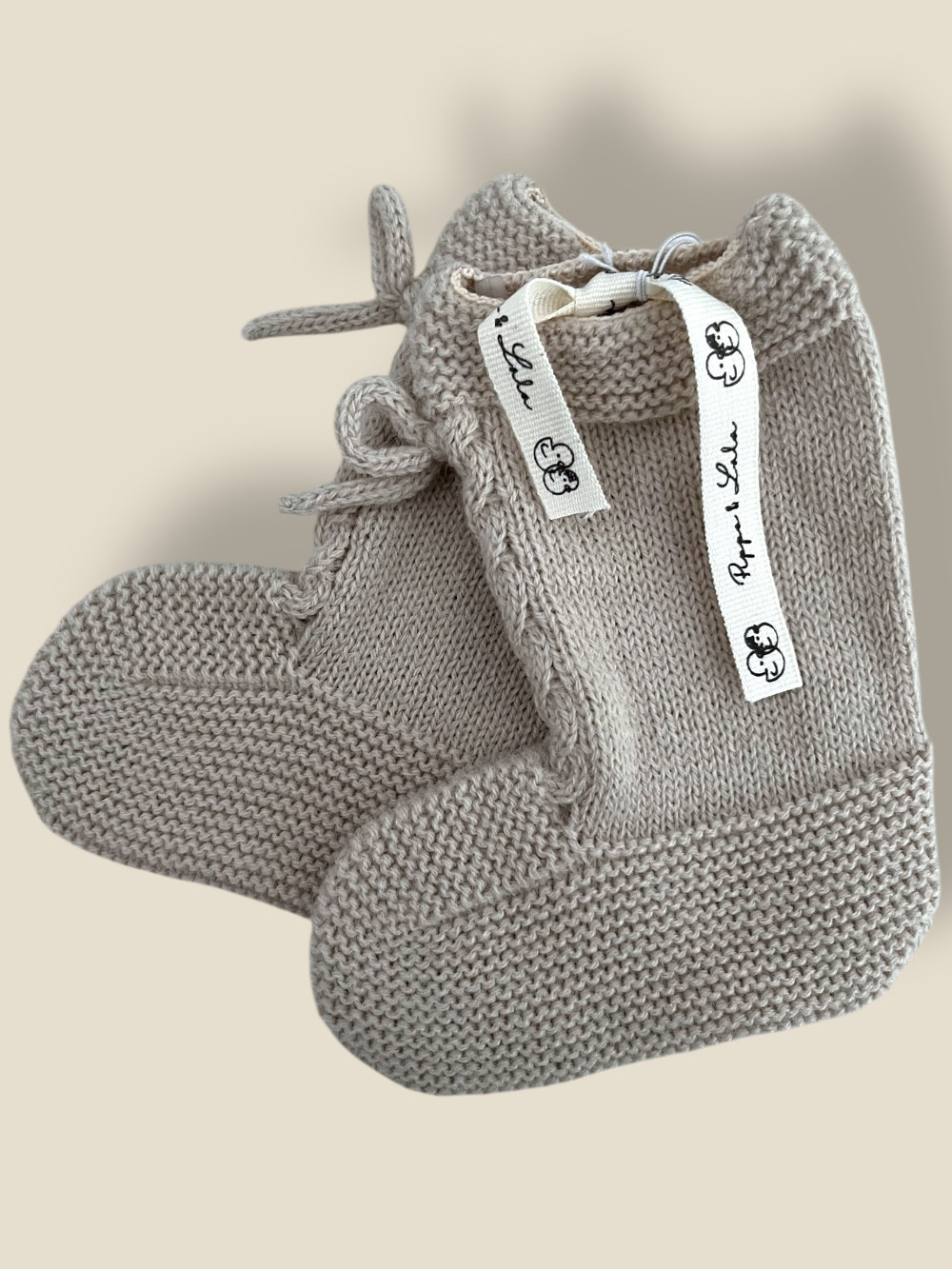 PATUCO BEIGE BOTITA CON OCHOS